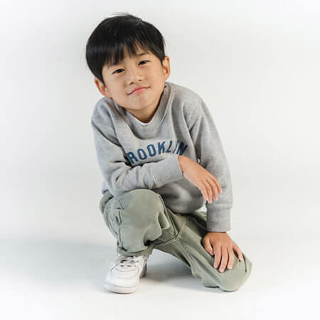 asian boy wearing grey hoodie